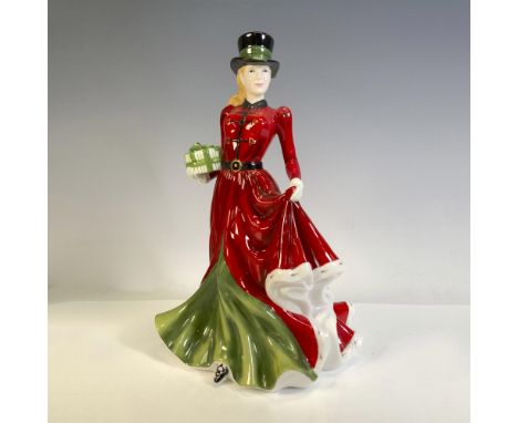 Part of the Christmas Day figures, figural is dressed in red and green outfit holding a present. Royal Doulton backstamp. Thi