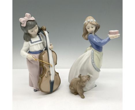 Glossy porcelain figures hand painted in soft colors of blue, rose, grey and brown. Girl playing Cello 2001035 and Puppy's Bi