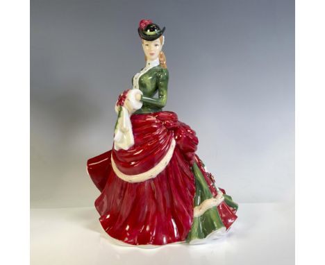 Part of the Season's Series, this lovely figural is dressed in festive holiday colors of red and green. Royal Doulton backsta