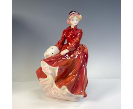 Part of the Classic Ladies Series, glossy figural dressed in red winter coat holding her white muff. Royal Doulton backstamp.