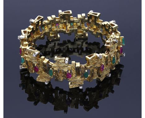 An 18ct gold gem-set bracelet, circa 1970, the abstract textured links alternately set with marquise-cut ruby and emeralds, e