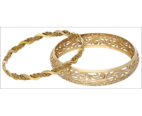 Two yellow precious metal bangles, the first concave in profile with pierced scrolling foliate design, together with a slimme