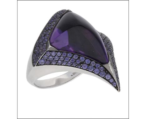 An amethyst and purple sapphire ‘Luna’ ring, by Shaun Leane, 2011, the polished fancy-cut amethyst within an abstract surroun