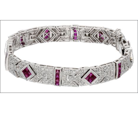A ruby and diamond panel bracelet, composed of articulated panels of calibré-cut rubies and brilliant-cut diamonds within bea
