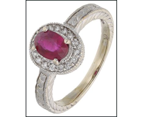 A ruby and diamond cluster ring, set with an oval-cut ruby weighing 1.02 carats, within a surround of brilliant-cut diamonds,