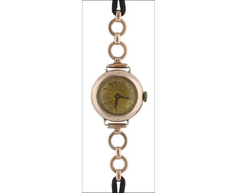 An early 20th century 9ct gold lady’s wristwatch by Rolex, the engine-turned dial signed ‘Alex Clark, London’ and ‘Rolex’, wi