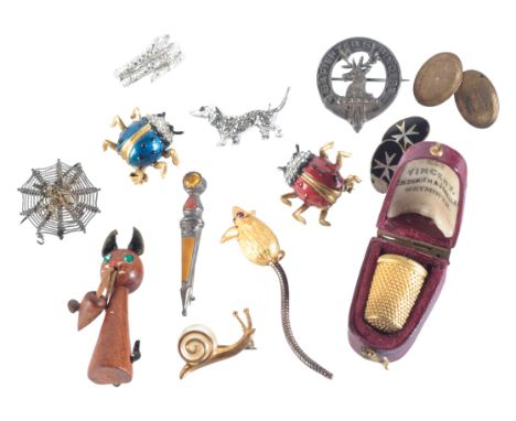 A COLLECTION OF COSTUME JEWELLERYincluding matching red and blue Capri ladybird brooches; a coiled snake ring; a spider's web