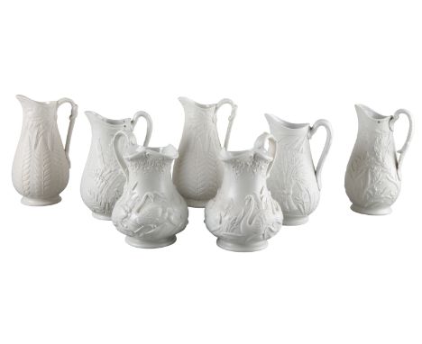 A COLLECTION OF SEVEN VICTORIAN RELIEF MOULDED STONEWARE JUGS including examples marked to the base W. Brownfield, Cobridge a