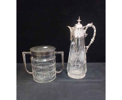 AN EDWARDIAN BISCUT BARRELby John Grinsell c 1910 with a faceted glass body and a silver-plated lid and twin handles, with a 