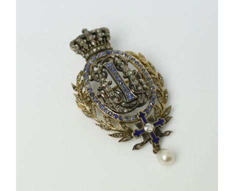 Diamantbrosche aus Adelsbesitz. 14 kt. GG, geprüft, brutto 8,8 g. Oval durchbrochen gearbeitet, mittig in Lorbeerkranz mit li