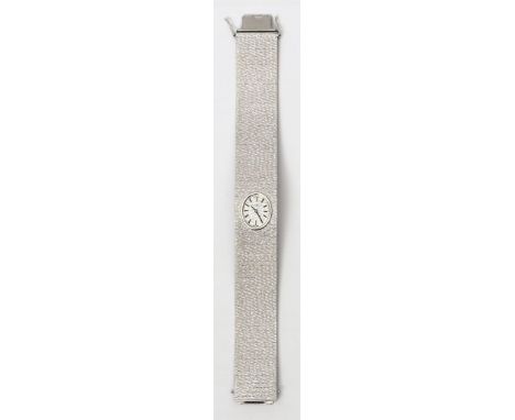Damenschmuckbanduhr "Juvenia". Ovales Gehäuse und integriertes Milanaiseband 750/000 WG, brutto 89 g. Ziseliertes WG-Zifferbl