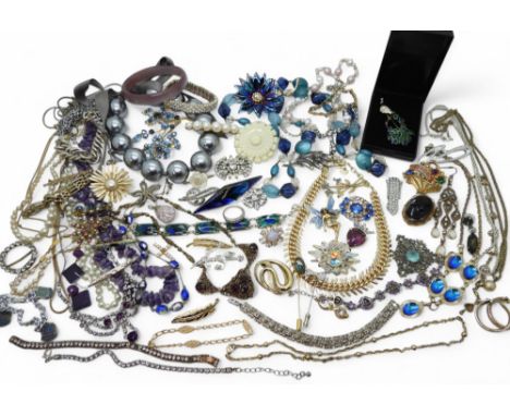 An enamelled peacock brooch, string of amethyst beads, vintage costume jewellery brooches and necklaces, diamante and marcasi