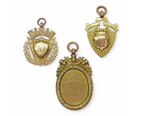 Three vintage 9ct gold medallion, a Dux medal, an Ambulance Corp team medal and a further School medal for Geography weight a