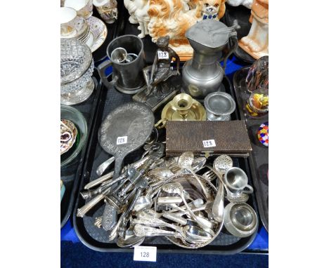 A spelter figure of a woman, a pewter tappit hen, a silver backed hand mirror, a horse corkscrew, assorted EPNS cutlery etc C