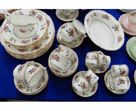 A Wedgwood Chinese Flowers pattern dinner service comprising dinner plates, medium plates, tea cups, saucers and side plates,