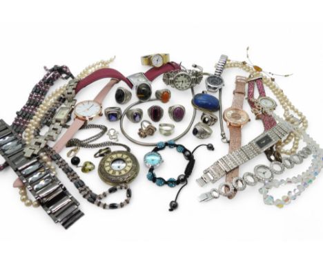 A collection of silver and white metal rings to include two Thai College style rings, an Edinburgh silver double rose ring ma