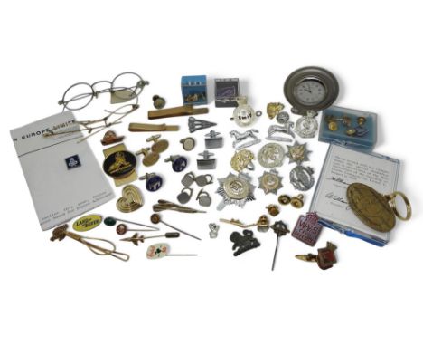 An Italian Naval submariner's stick pin, a further collection of military badges, a small lion passant badge or mount, cuffli