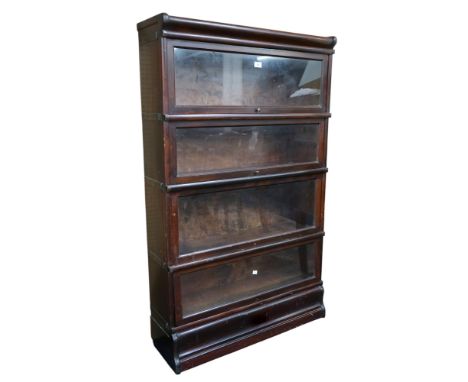 An early 20th century Globe Wernicke four tier sectional bookcase with fall front glazed doors on plinth base, 142cm high x 8