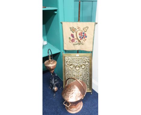 A lot comprising a late 19th century Arts &amp; Crafts embossed brass decorative panel, Arts &amp; Crafts pole fire screen, c
