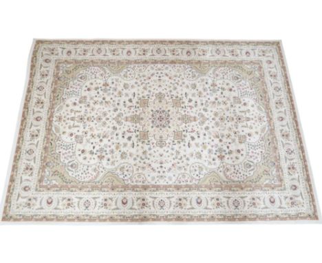 A cream ground Tabriz style rug with sunburst central medallion and beige spandrels on floral pattern ground within cream flo