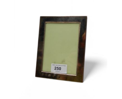 A silver-mounted photoframe, by Mappin &amp; Webb, Sheffield 2006, 15 x 11.5cm Condition Report:Available upon request