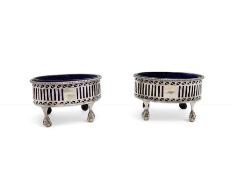 A pair of George III silver salts, by Robert Hennell, London 1778, on four ball and claw feet with openwork urn panels, with 