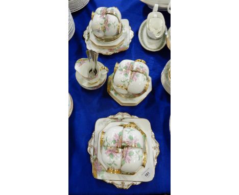 A Paragon Poinsettia pattern tea set comprising twelve cups, saucers and plates, two cake plates, milk jug, sugar bowl and te