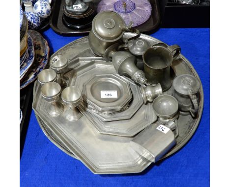 A George III pewter sifter, assorted measures, trays, a charger etc Condition Report:Available upon request