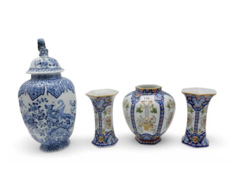 A Delft style blue and white jar and cover decorated with a birds amongst flowers and foliage, together with a pair of vases 