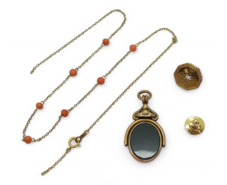 A yellow metal tie stud set with a diamond, together with a (af) 9ct gold chain set with coral beads, weight 5.1gms, together