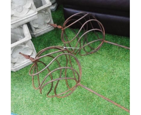 GARDEN CLIMBING FRAMES, a pair, Continental wrought iron in a rustic finish with globe style tops, top 33cm W x 170cm L. (2)