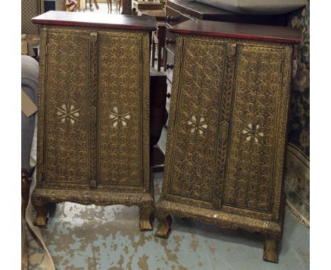 BEDSIDE CUPBOARDS, a pair, Oriental design gilt and red painted with beaded and mirrored decoration, the doors enclosing sing