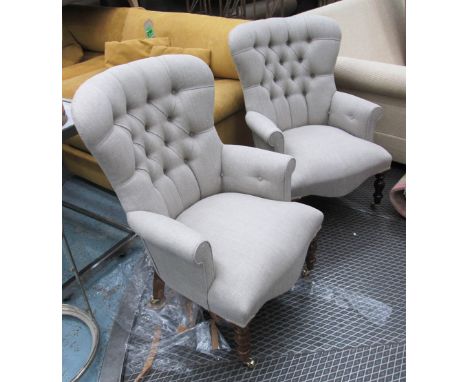 ARMCHAIRS, a pair, button back in neutral fabric on turned castor supports, 68cm W. (2)