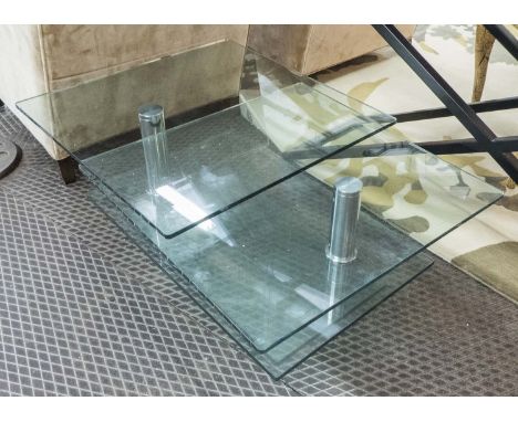 ARTICULATING LOW TABLE, in glass with glass under shelf on chromed metal supports, 99cm x 70cm x 39cm H.