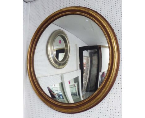 MIRROR, circular in a gilded frame, 100cm diam.
