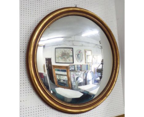 MIRROR, circular in a gilded frame, 100cm diam.