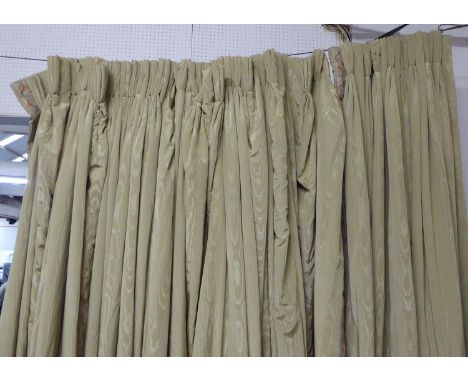 CURTAINS, in green silk moire, lined and interlined, with applied woven border two pairs each curtain approx 230cm W gathered
