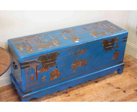 Blue lacquered and chinoiserie painted trunk, the interior decorated with Chinese characters and figures, 53cm high by 116cm 