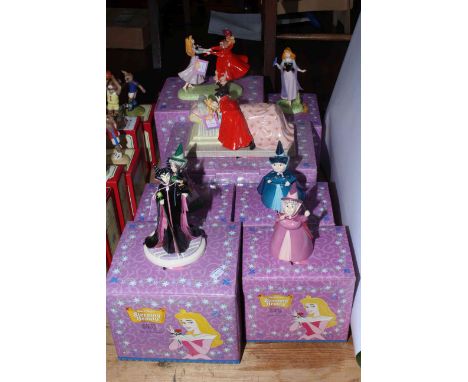 Disney Showcase Collection including Loves First Kiss, and Sleeping Beauty, seven pieces with boxes.