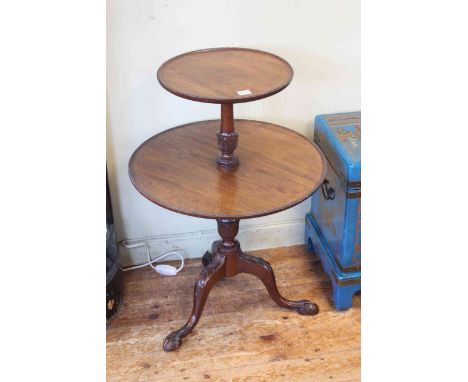 Mahogany two tier graduated circular dumb waiter on pedestal tripod base, 81cm high.