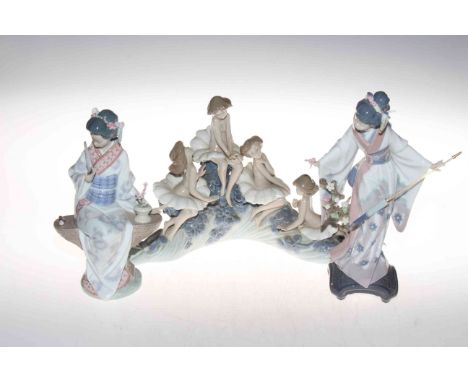 Two Lladro figures, Teruko Japanese Girl with Umbrella, and Geisha with Fan, together with Nao girls on foaming wave (3).