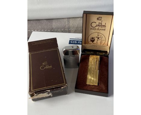 A vintage boxed Colibri of London duo-flame gold plated lighter together with a Ronson West German made lighter [WILL NOT SHI