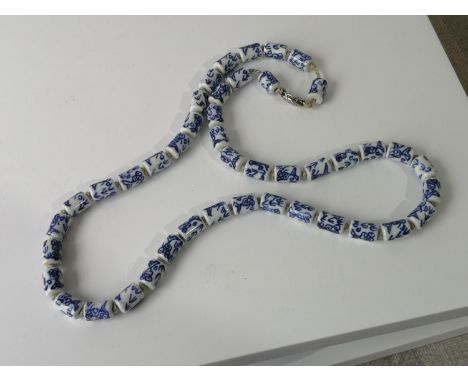 A CHINESE BLUE AND WHITE CERAMIC BEAD NECKLACE 