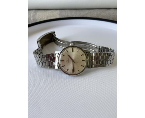 A vintage gents Omega Geneve watch, fitted with a Seiko strap, in a working condition 