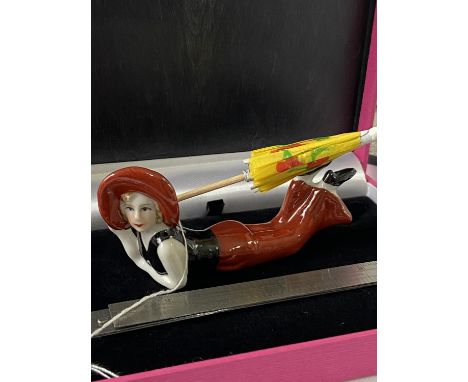 A Vintage ceramic Art Deco style lady figurine with parasol. [9.5cm in length] 