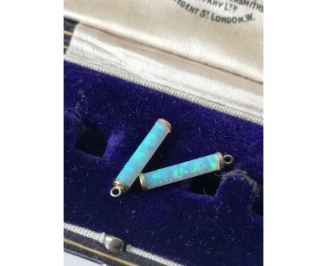 A Pair of 9ct gold [tested] and opal cylinder charms/ earrings [1.5cm in length] [0.48grams] 