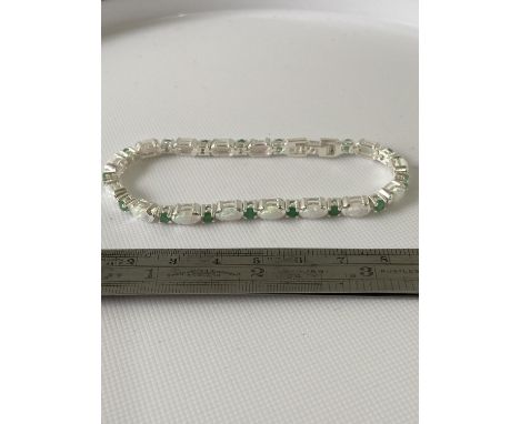 A Silver opal and emerald line bracelet [18.5cm in length] 