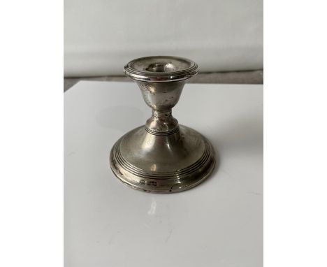 A London silver dwarf candlestick, with a weighted base [height 7cm] 