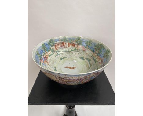 A LARGE 19TH CENTURY CHINESE HAND PAINTED BOWL. EXTERIOR DEPICTS CHINESE HUNTING SCENE PANELS. THE INTERIOR SHOWS AN ENGLISH 