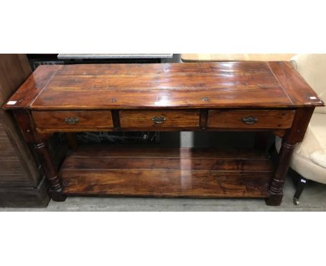 A George III style hardwood three drawer console table 